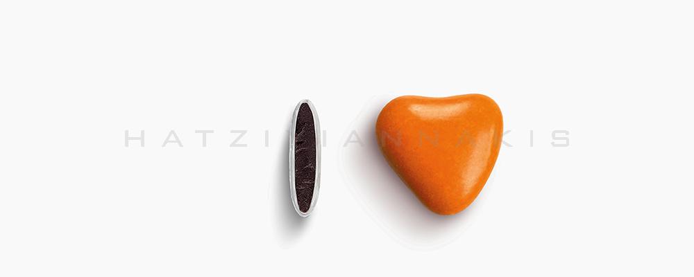 Κουφέτα Χατζηγιαννάκη Σοκολάτας Καρδιά 1102_095 με χρώμα πορτοκαλί, γυαλισμένο - συσκευασία ενός κιλού 1kg - για τις μπομπονιέρες του γάμου σας ή της βάπτισης του παιδιού σας