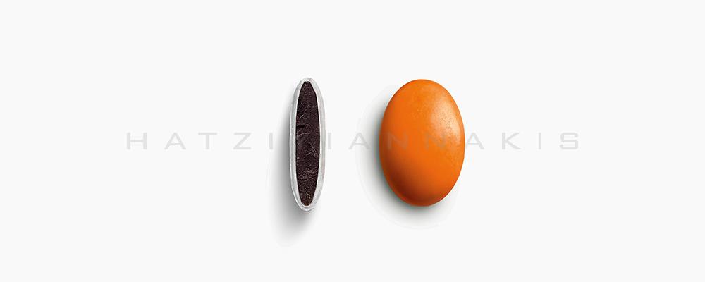 Κουφέτα Χατζηγιαννάκη Σοκολάτας Piccolino 1352_095 με χρώμα πορτοκαλί, γυαλισμένο - συσκευασία ενός κιλού 1kg - για τις μπομπονιέρες του γάμου σας ή της βάπτισης του παιδιού σας